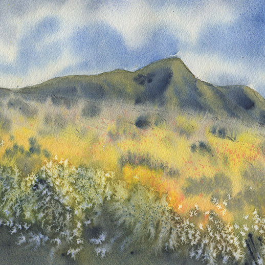 Watercolor painting of a mountain landscape with yellow and green hues